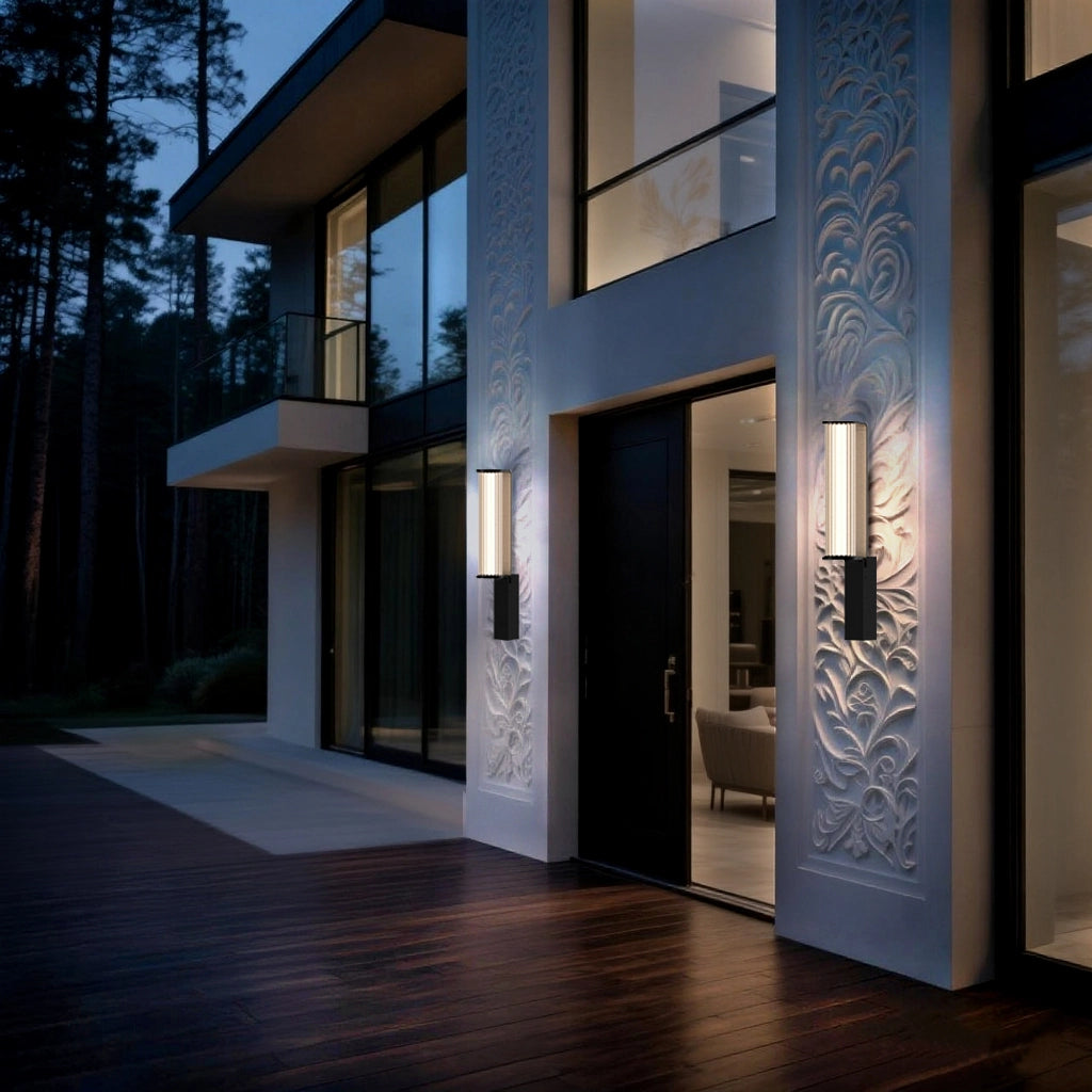 Wall lamps line the intricately carved exterior walls of the villa, casting a warm and graceful glow.