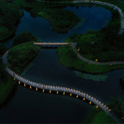 Looking down from the air, the winding road decorated with Low Profile Outdoor Path Light has a unique atmosphere at night.