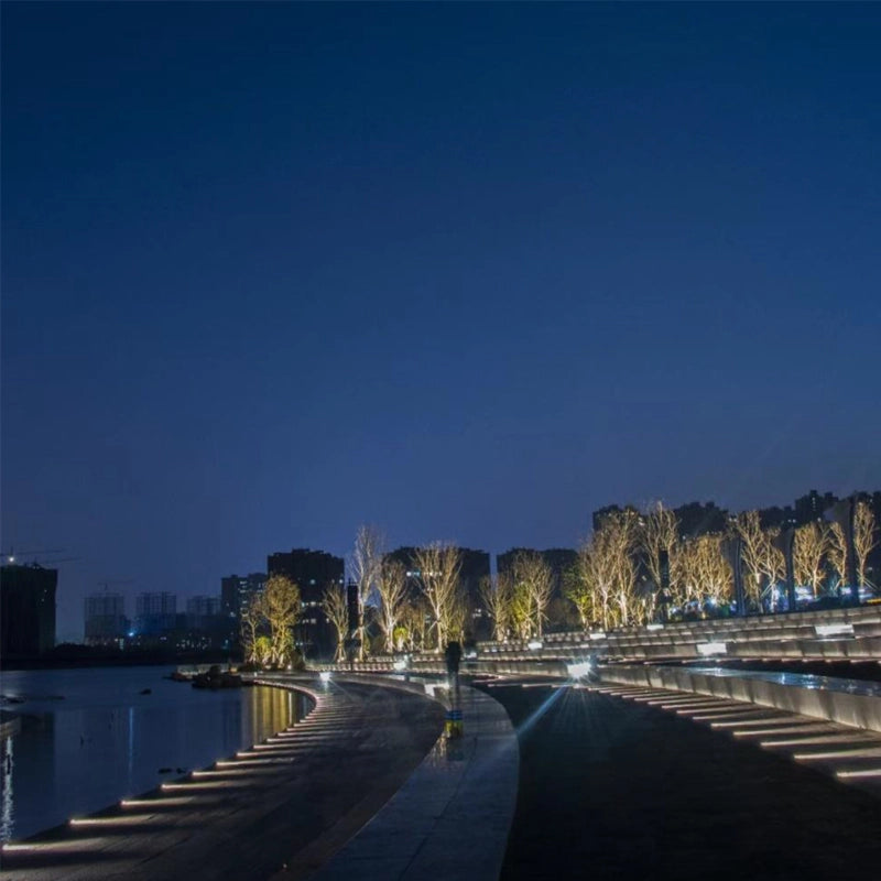 On each level of the steps leading to the central lake shore, there are small path lights with this wonderful design