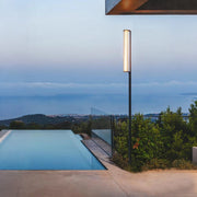 In the evening, the double-head floor lamp by the pool emits a soft and cozy light, creating a peaceful ambiance.