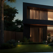 On the courtyard lawn, two lawn lamps emit warm light, illuminating the surrounding green plants. Blending with the lights of the villa and the night, it creates a quiet and stylish atmosphere and presents a comfortable outdoor living scene.