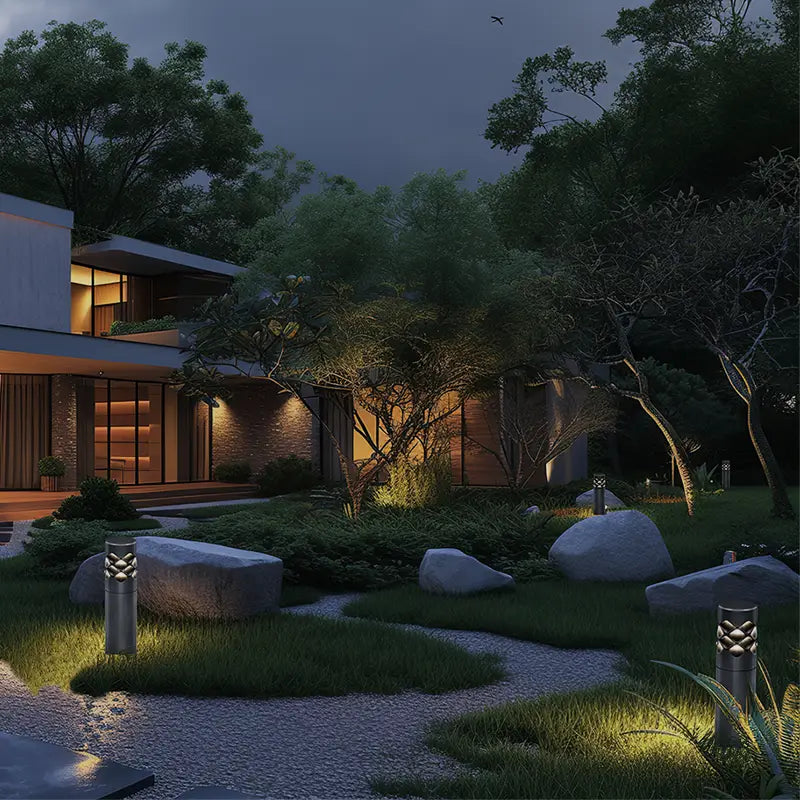 In a corner of the courtyard, the Ripple Beam Garden Light adds elegance surrounded by gravel and green plants.